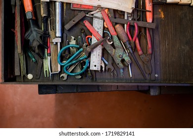 Instruments on wooden table or an old workbench