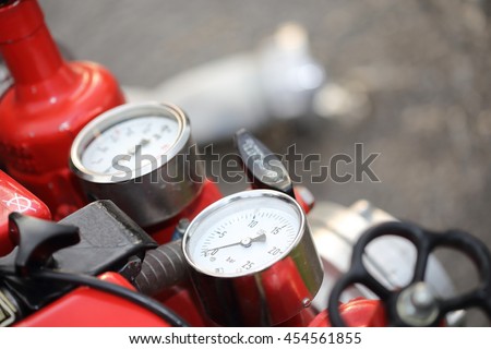 Instruments of a red firefighter centrifugal pump