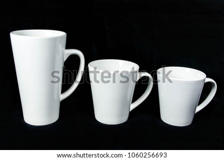 insulated unprinted cups for sublimation of different shapes, colors and designs designer on a black background isolated