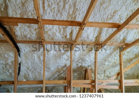 Insulation of attic with foam polyurea insulation cold barrier and insulation material
