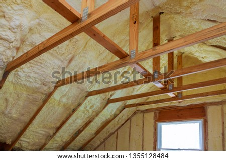 Insulation of attic with foam polyurea insulation cold barrier and insulation material