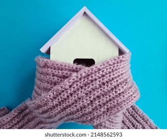 Insulation Of Houses And Increase In Gas Tariffs. Home Insurance And Cold Winter Concept And Warm Scarf On House