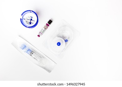 Insulin Ampoule And Continuous Glucose Monitor CGM, Equipment Isolated On White Background. Health Protection, Diabetes, Low Blood Glucose Concept