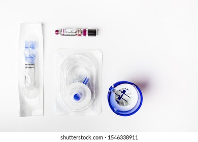 Insulin Ampoule And Continuous Glucose Monitor CGMequipment Isolated On White Background. Health Protection, Diabetes, Low Blood Glucose Concept