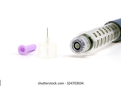 Insulin And Needle Separately On A White Background