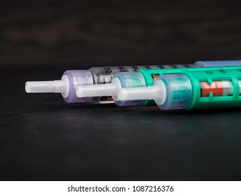 Insulin pen. Medical devices is used to self-injection for treatment diabetes disease.  health care concept. - Shutterstock ID 1087216376