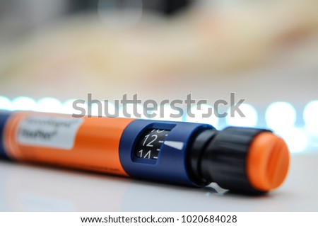 Insulin pen. Medical devices is used to self-injection for treatment diabetes disease. World diabetes day and health care concept.