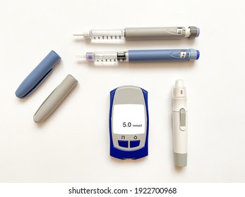 Insulin Short, Long, Glucose Meter, Test Strips And Finger Piercing Pen On A White Isolated Background. Set For Diabetics With Mock Up