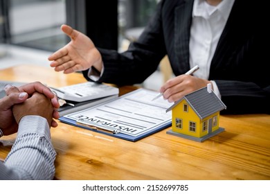 Insurance agent broker man holding document and present pointing showing an insurance policy contract form to client Business Communication Connection Concept