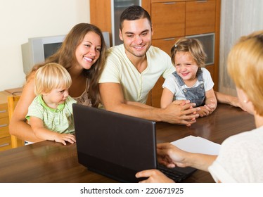 Insurance Agent Consulting Happy Young Family With Kids Indoor 