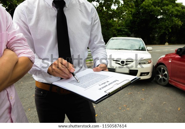 The insurance agent working\
claim process in payment on from parties .Insurance claim concept\
.
