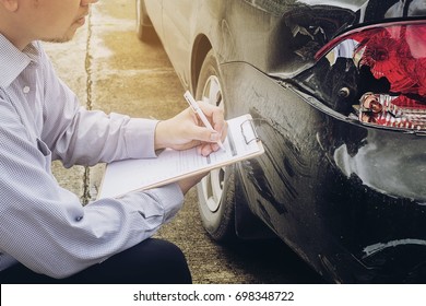 Insurance Agent Working On Car Accident Claim Process