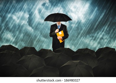 Insurance agents in heavy rain. Businessmen with umbrella gathering for protest.