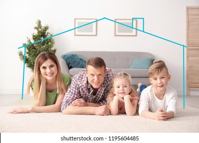 Insurance Concept. Contour Of House Around Happy Family Lying On Floor At Home 