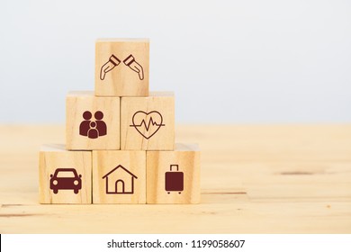 Insurance Concept, Wooden Cube Symbolize Put The Insurance To Protect Or Cover Person, Property ,Liability, Reliability,car, Life, Business, Health, House, Legal Expenses, Travel