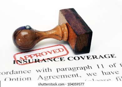 Insurance Coverage And Wooden Stamp