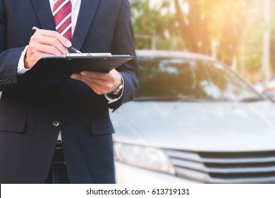 An Insurance Expert Employee Working With A Car At Outdoor