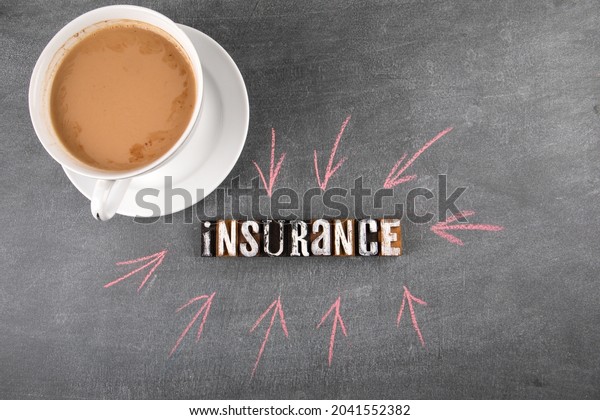 Insurance. Health, benefits and property\
concept. Word from wooden\
letters.