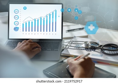 Insurance Healthcare  Doctor analyzing medical  report and medical  on hospital background - Powered by Shutterstock