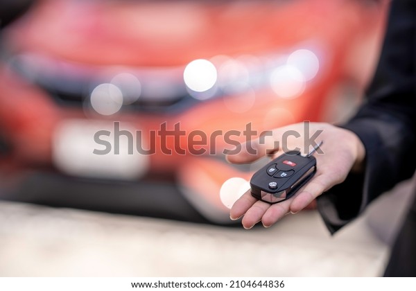 Insurance officers\
hand over the car keys after the tenant. have signed an auto\
insurance document or a lease or agreement document Buying or\
selling a new or used car with a\
car