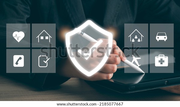 Insurance online\
digital technology concept. Hand using labtop buy family, car,\
health and travel Insurance Policy Protection icon on virtual\
screen , Accident Claim Risk\
Defense.