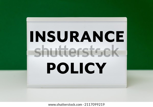 Insurance Policy text on\
green background