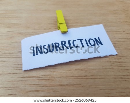 Insurrection writting on table background.
