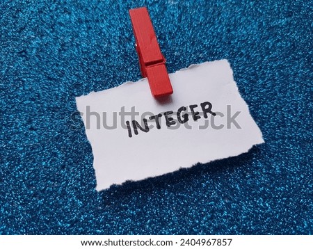Integer writing on a blue background.