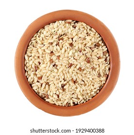 Integral, brown rice pile in clay pot isolated on white background, top view - Shutterstock ID 1929400388