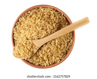 Integral uncooked rice pile in clay pot and wooden spoon isolated on white, top view   - Shutterstock ID 2162757829