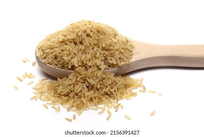 Integral uncooked rice pile in wooden spoon isolated on white   - Shutterstock ID 2156391427