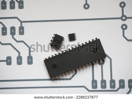 Integrated circuits and microchip on electronic schema background.