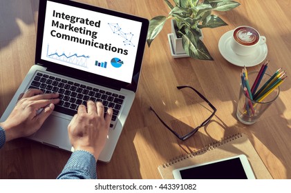 integrated marketing communications    (IMC) man hand on table Business, coffee, Split tone