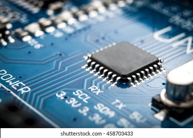 Integrated semiconductor microchip/ microprocessor on blue circuit board representative of the high tech industry and computer science