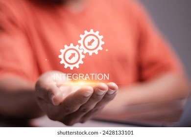 Integration data system concept. System Integration technology, Business and automation solutions. person holding Integration icon on virtual screen for industrial and smart technology. 