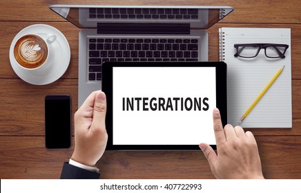 INTEGRATIONS , on the tablet PC screen held by businessman hands - online, top view