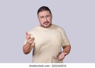 A intellectual person in a casual shirt explaining in elaborate fashion. Using hand gestures while talking. Public speaking concept. - Shutterstock ID 2222163515