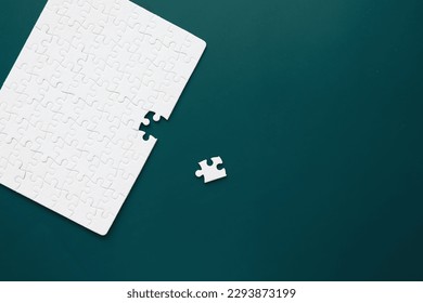 Intellectual puzzles. The puzzle empty. The hand puts together puzzle pieces. Brain training.