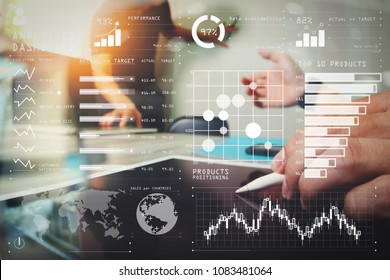 Intelligence (BI) and business analytics (BA) with key performance indicators (KPI) dashboard concept.two colleagues web designer discussing data and blank screen digital tablet and computer laptop. - Shutterstock ID 1083481064