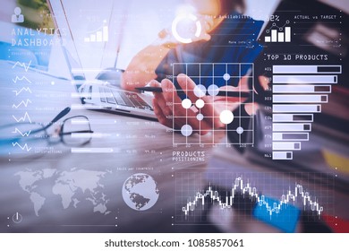 Intelligence (BI) And Business Analytics (BA) With Key Performance Indicators (KPI) Dashboard Concept.designer Hand Working With Digital Tablet And Laptop Computer And Book Stack And Eye Glass.