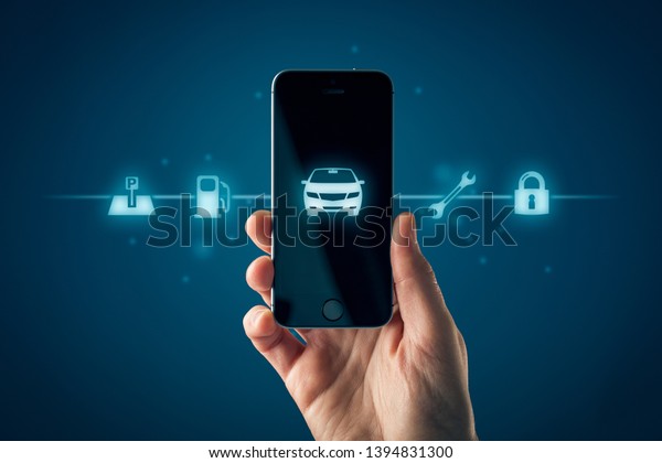 Intelligent car smart phone app concept,\
intelligent vehicle and smart cars concept. hand with smart phone\
with symbol of the car and information about parking location,\
fuel, service and\
security.