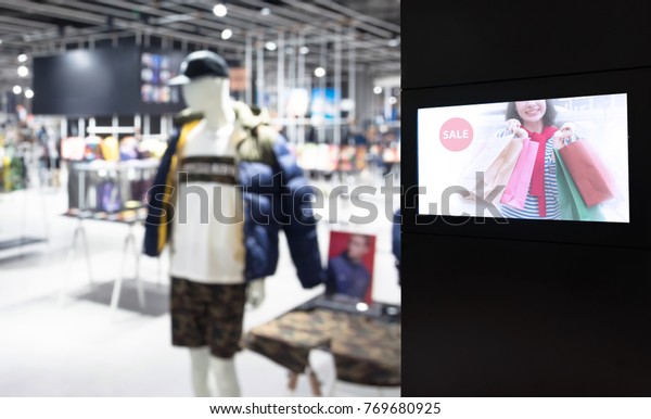 Intelligent Digital\
Signage , Augmented reality marketing and face recognition concept.\
Interactive artificial intelligence digital advertisement in\
fashion retail shopping\
Mall.