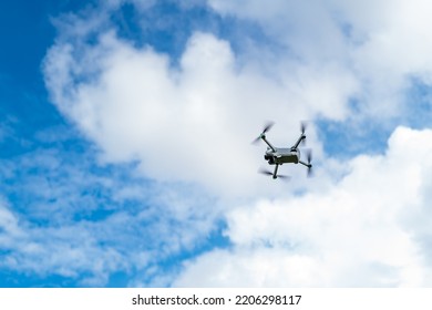 Intelligent droneUAV seen heading skywards for a photography shoot. The four routers and anti collision light are clearly visible.