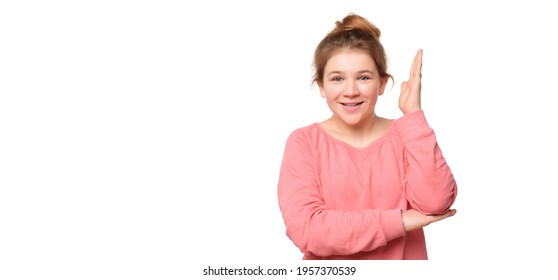 Intelligent Enthusiastic Teen Girl Raises Her Hand Up With A Happy Smile To Attract Attention And Answer A Question, Isolated On White Background