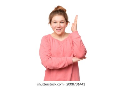 Intelligent Enthusiastic Teen Girl Raises Her Hand Up With A Happy Smile To Attract Attention And Answer A Question, Isolated On White Background