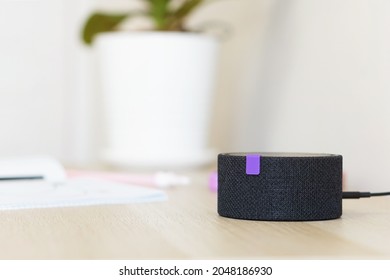 Intelligent Home Assistant. Interactive Speaker For A Child. A Smart Speaker With Voice Communication Is On The Table In The Children's Room. Give Commands To Turn On Turn Off.