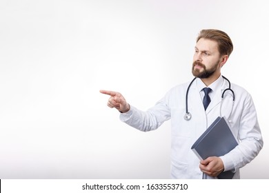 Intelligent Physician In White Smock Pointing At Something