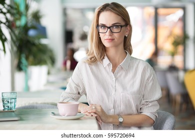 Intelligent Young Woman Resting In Coffee Shop