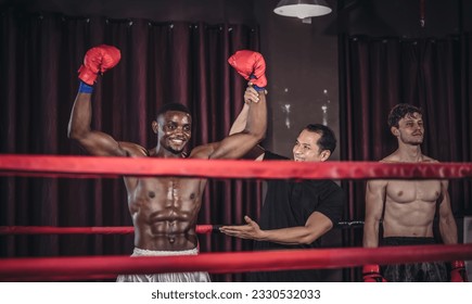 In an intense boxing match, a dedicated professional boxer showed commitment, determination. Emerging as champion, delivering knockout. His perseverance paid off, leaving him delighted and fulfilled. - Powered by Shutterstock