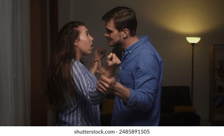 Intense Domestic Dispute Between Actors Portraying a Couple in Conflict - Powered by Shutterstock